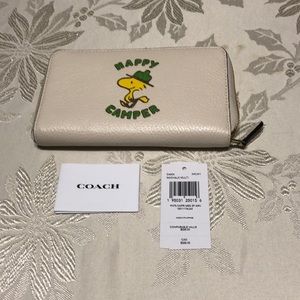NWT, Coach X Peanuts ID Zip Wallet Happy Camper featuring Wood Stock